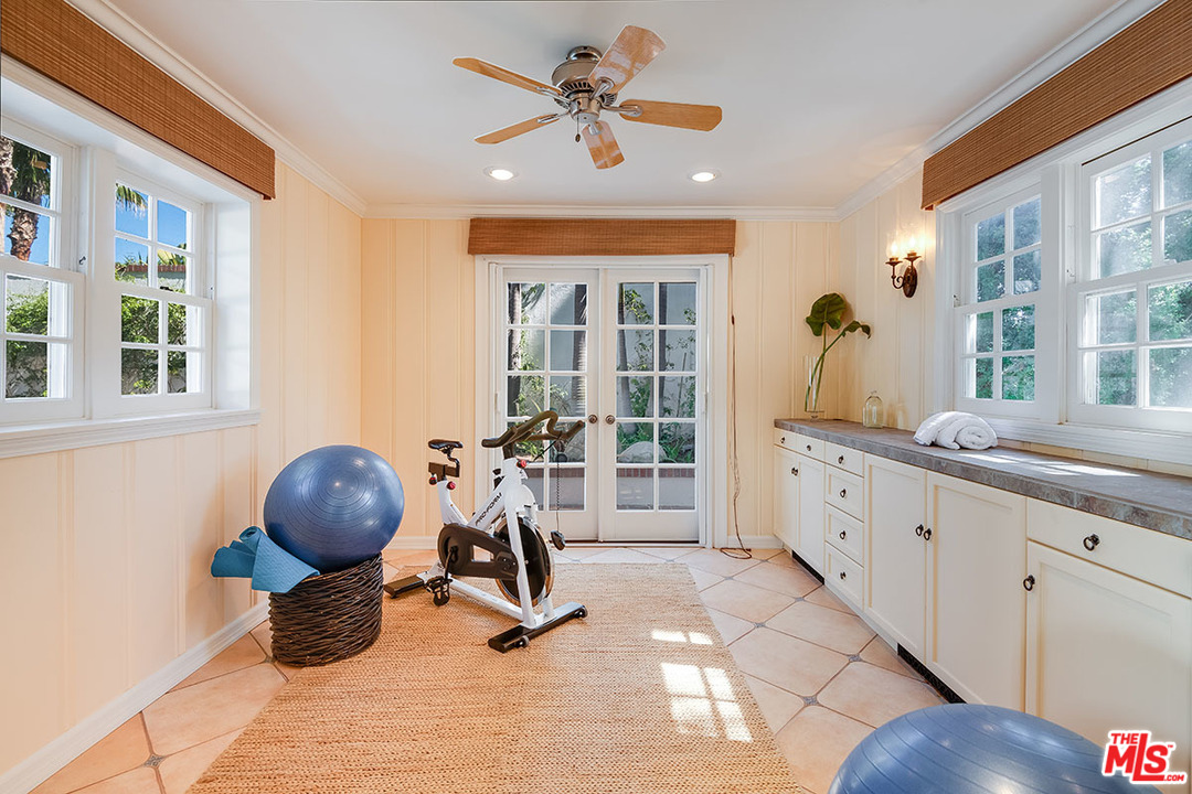 11610 Bellagio Road Los Angeles, CA 90049 - Photo 42 of 46 a living room with furniture and a large window
