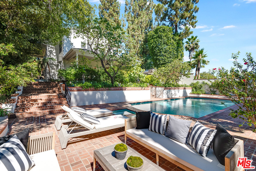 11610 Bellagio Road Los Angeles, CA 90049 - Photo 43 of 46 swimming pool view with a seating space