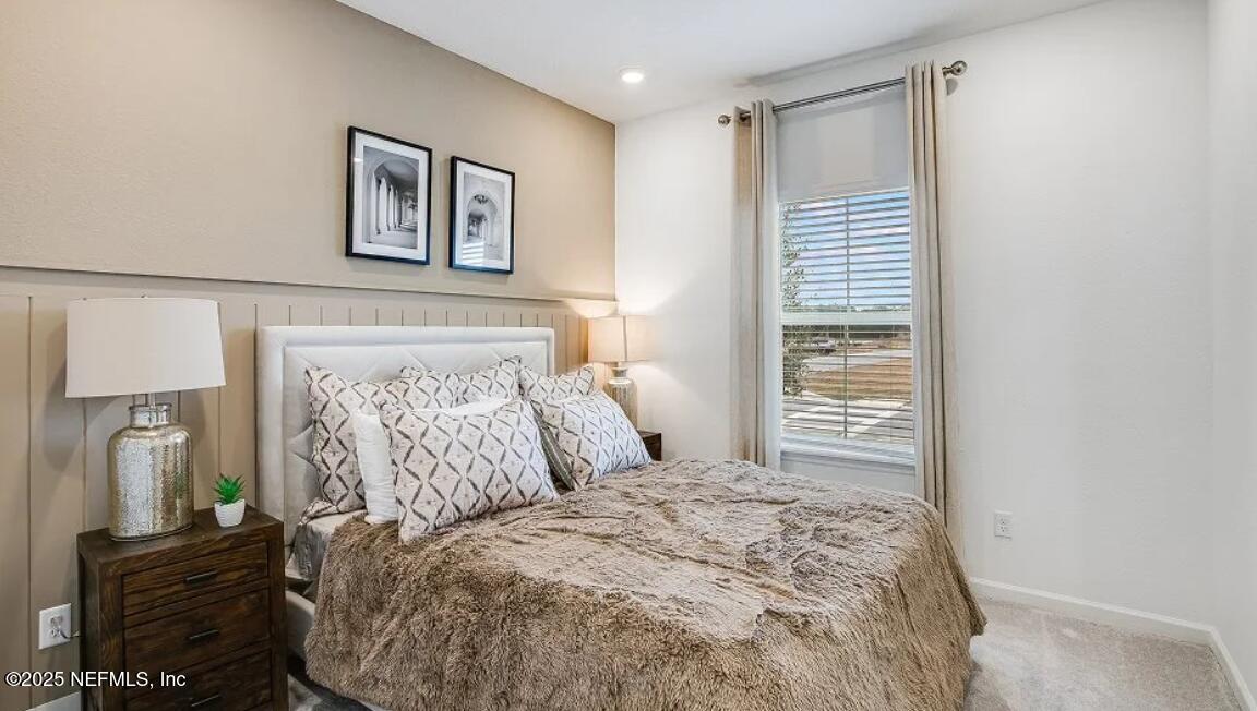 73 Whitmore Drive St. Augustine, FL 32092 - Photo 20 of 30 a bedroom with a bed and a television