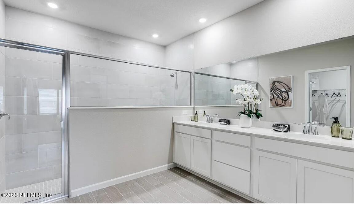 73 Whitmore Drive St. Augustine, FL 32092 - Photo 29 of 30 a bathroom with a sink and mirror