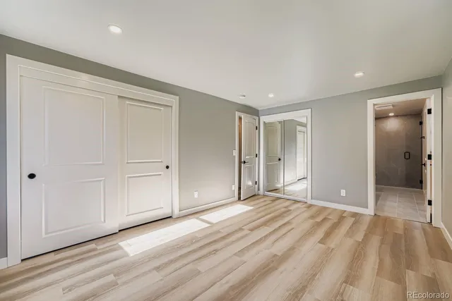 a bathroom with a double vanity sink toilet and shower