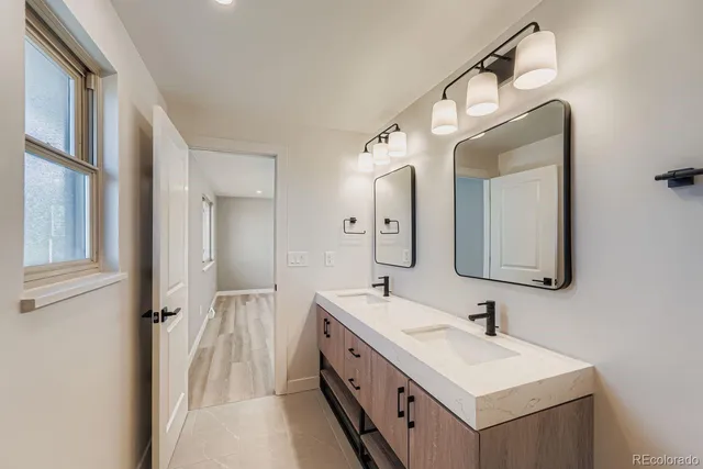 a bedroom with bed and a potted plant
