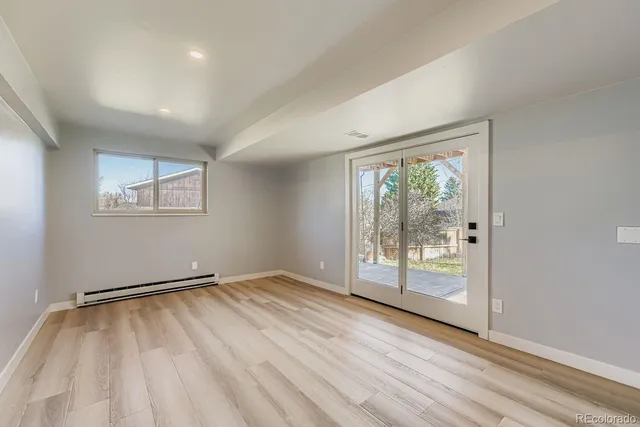 a view of balcony with wooden floor and fence