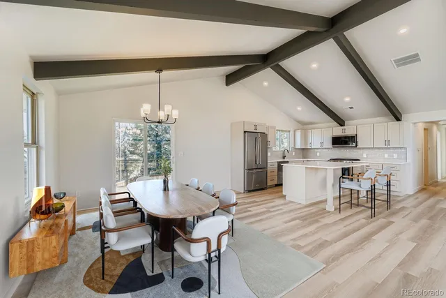 a dining room with furniture and window