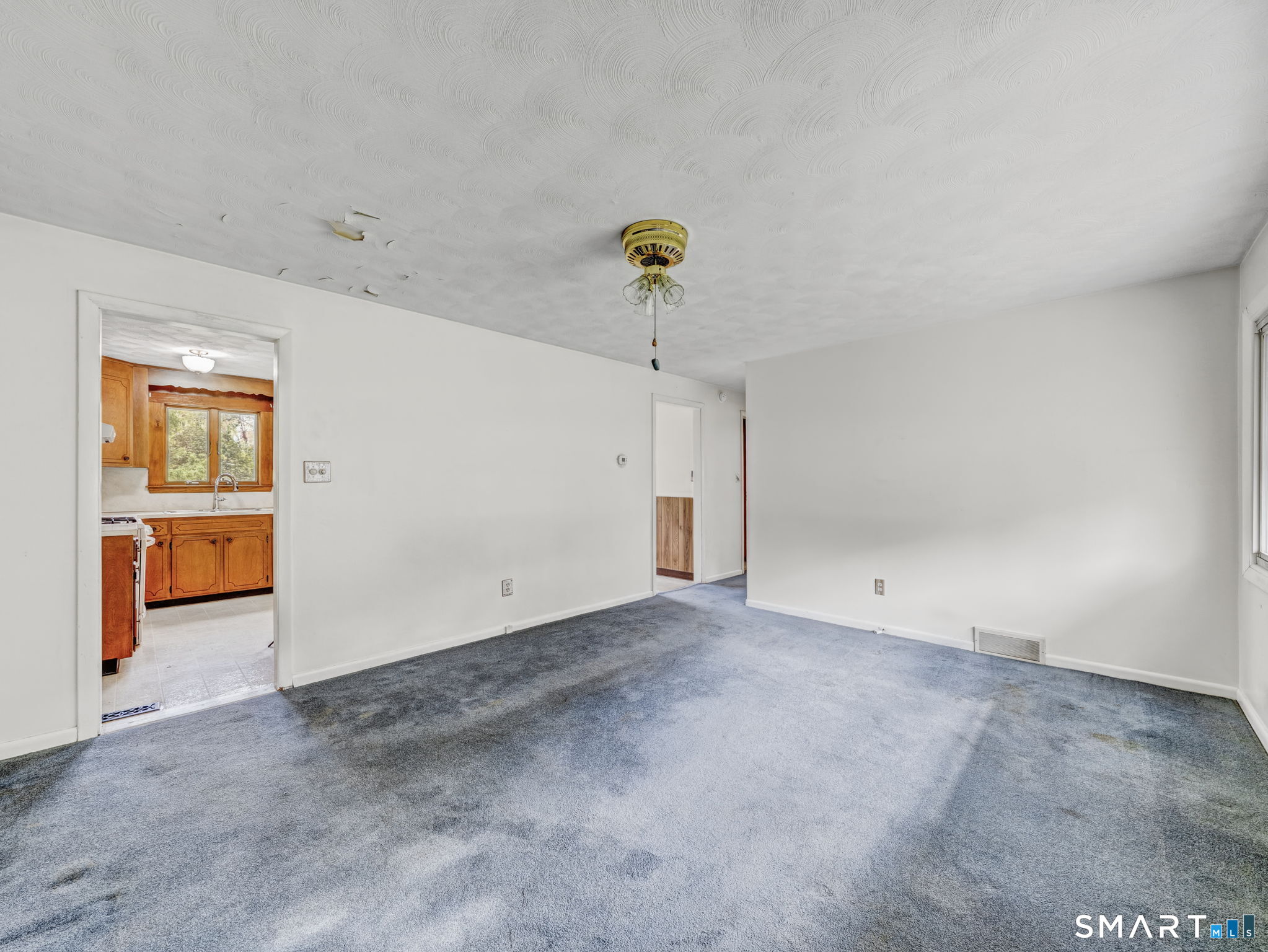 105 O'Donnell Road New Britain, CT 06053 - Photo 5 of 33 Spacious living room with wall to wall carpet over hardwood floors