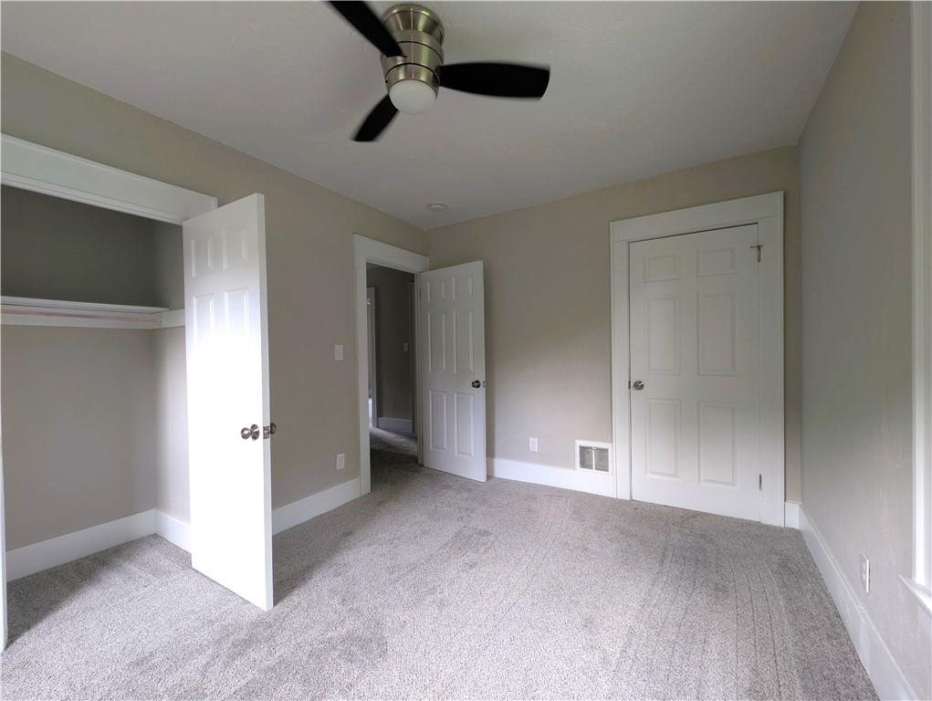555 Steel Hill Road Mount Morris, PA 15349 - Photo 15 of 19 an empty room with closet and windows