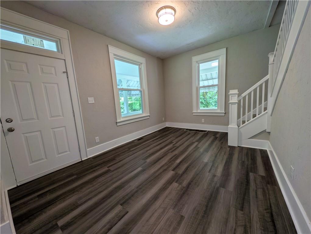 555 Steel Hill Road Mount Morris, PA 15349 - Photo 9 of 19 a view of an empty room with wooden floor and a window