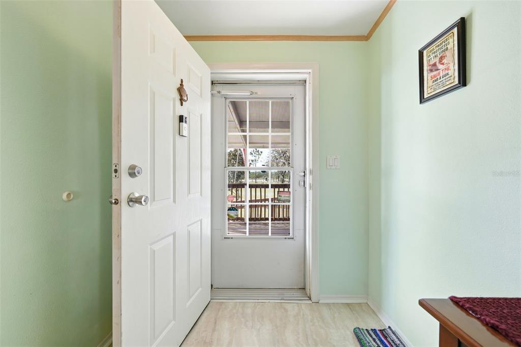 630 Otto Polk Road Frostproof, FL 33843 - Photo 17 of 44 a view of an entryway with wooden floor