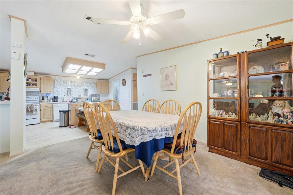 630 Otto Polk Road Frostproof, FL 33843 - Photo 21 of 44 a view of a dining room with furniture