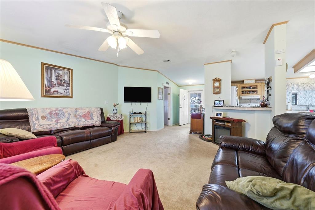 630 Otto Polk Road Frostproof, FL 33843 - Photo 24 of 44 a living room with furniture and a flat screen tv