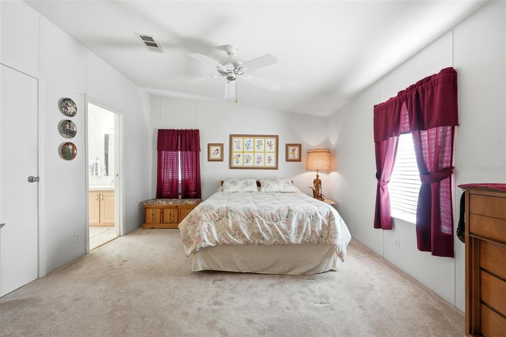 630 Otto Polk Road Frostproof, FL 33843 - Photo 29 of 44 a bed room with a bed and a chair