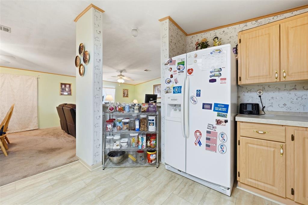 630 Otto Polk Road Frostproof, FL 33843 - Photo 30 of 44 a white refrigerator freezer sitting inside of a kitchen