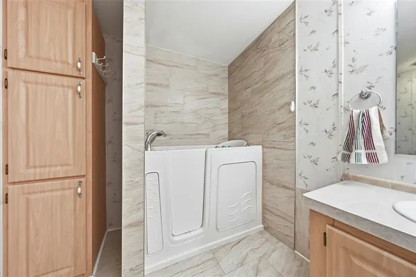 a en suite bathroom with a sink and a mirror