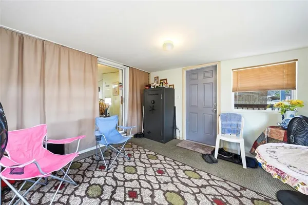 a bedroom with bed and chair