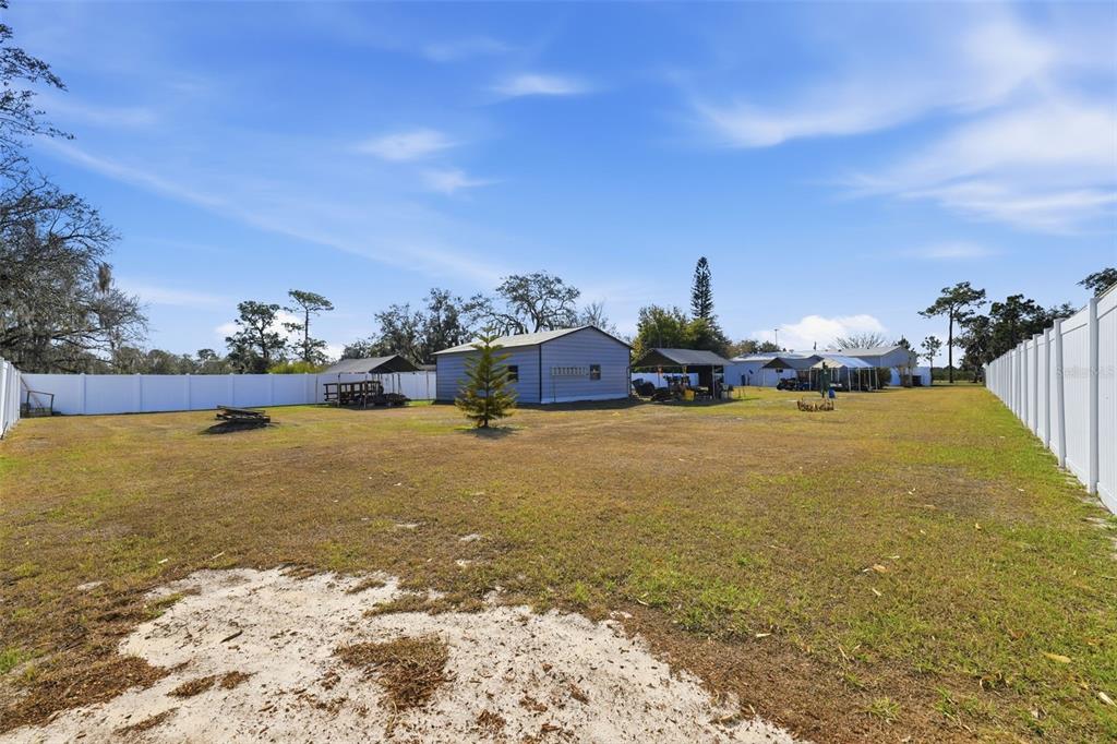 630 Otto Polk Road Frostproof, FL 33843 - Photo 9 of 44 a front view of a house with a yard