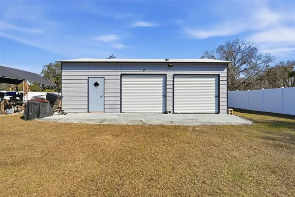a view of a pathway of a house with wooden stairs