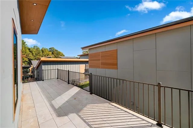 a balcony view with two chairs