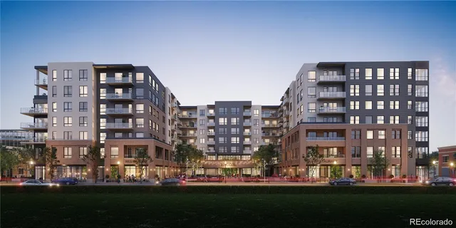 a view of a patio with couches table and chairs with wooden floor