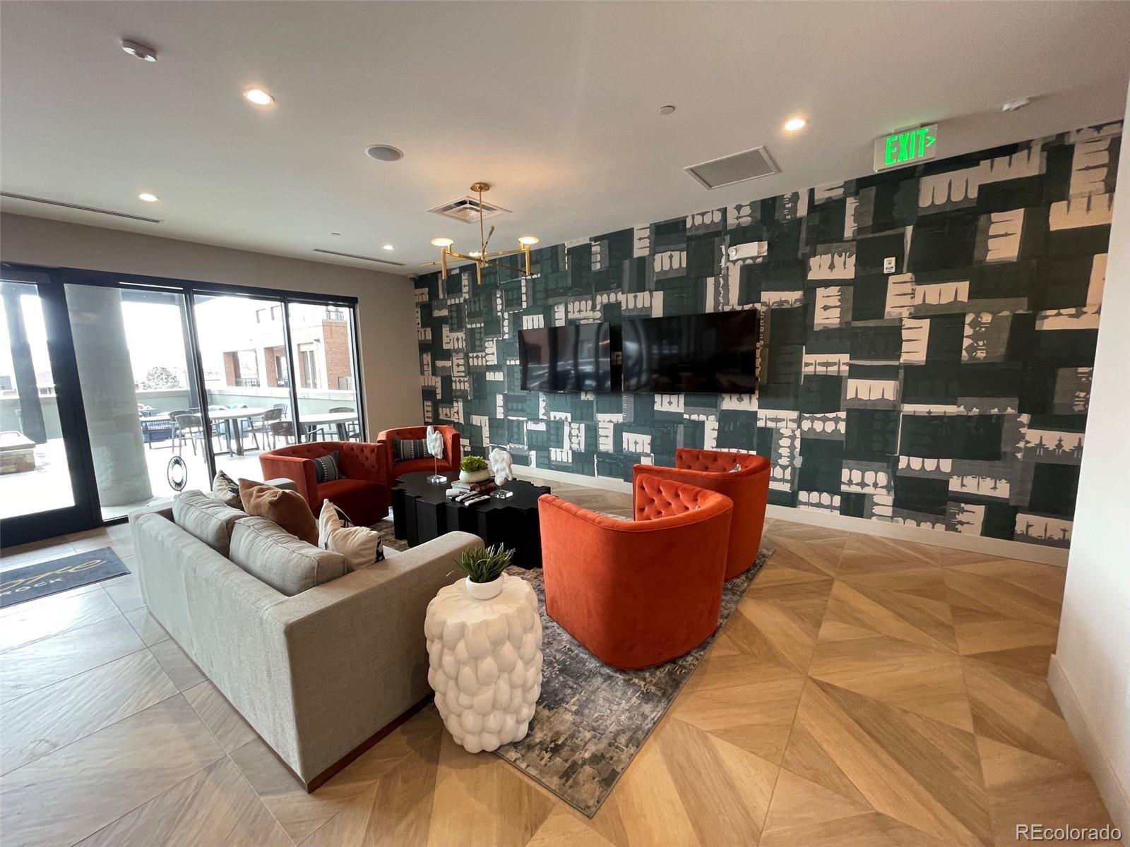 20 Wilcox Street, Unit 518 Castle Rock, CO 80104 - Photo 26 of 34 a living room with patio furniture and a large window