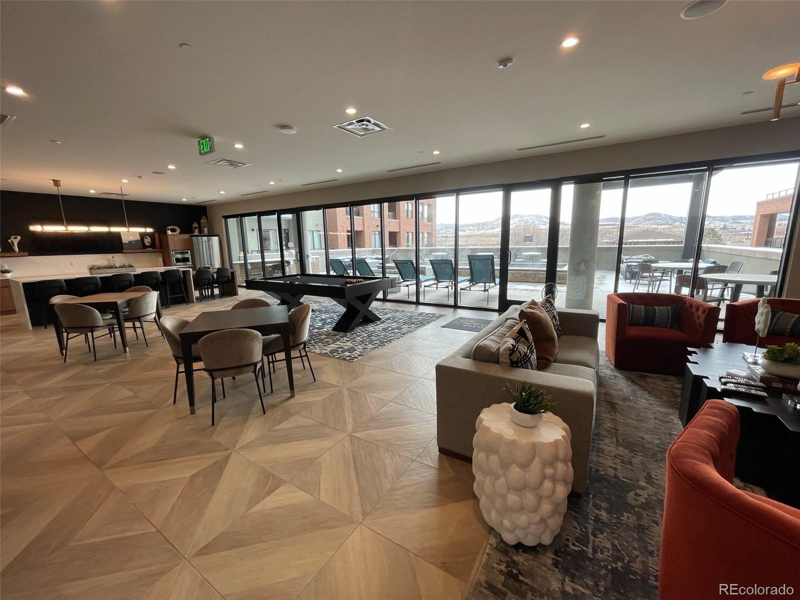 20 Wilcox Street, Unit 518 Castle Rock, CO 80104 - Photo 27 of 34 a living room with furniture and a large window