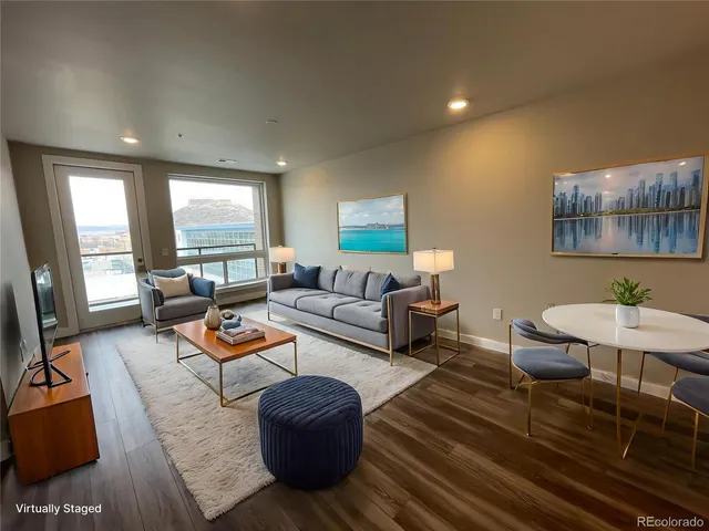 a bathroom with a sink a toilet a mirror and vanity
