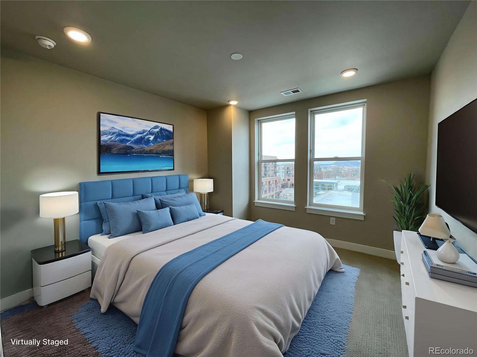 20 Wilcox Street, Unit 518 Castle Rock, CO 80104 - Photo 5 of 34 a bedroom with bed and a flat screen tv