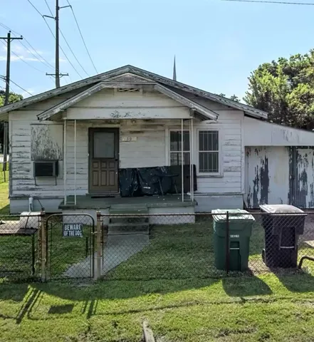 a front view of a house with swimming pool