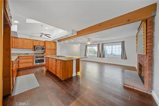 a kitchen with stainless steel appliances granite countertop a stove and a sink