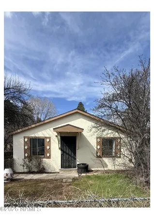 a view of house with yard