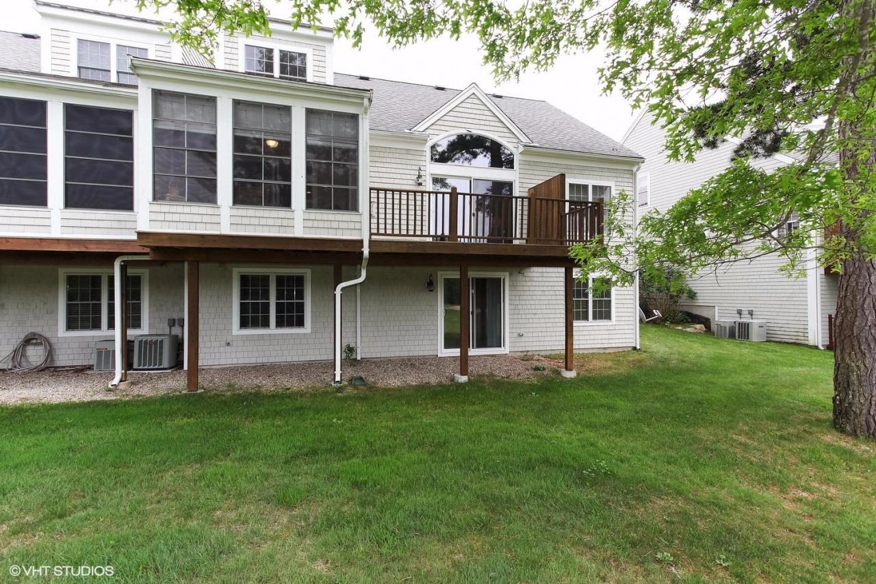 16 Turnberry Road Bourne, MA 02532 - Photo 17 of 20 a front view of a house with a yard