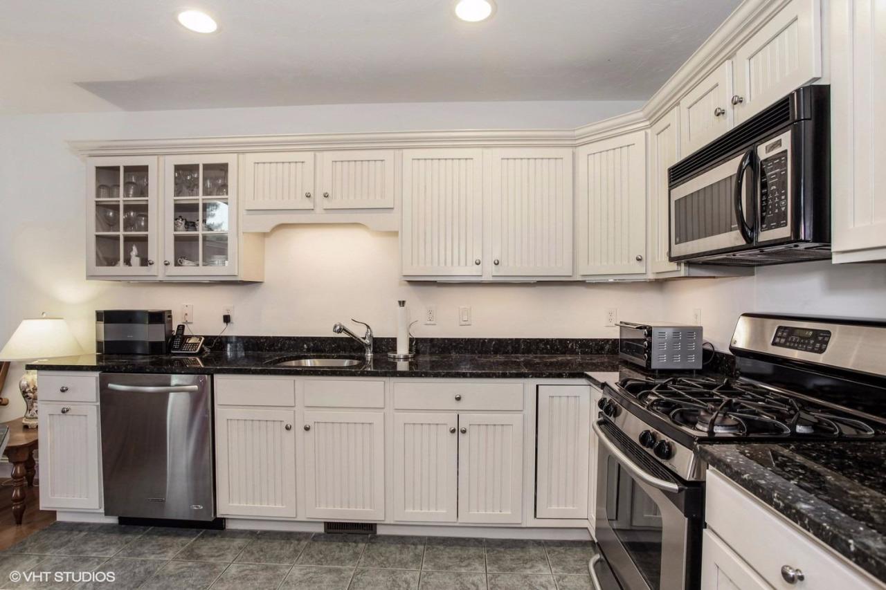 16 Turnberry Road Bourne, MA 02532 - Photo 6 of 20 a kitchen with granite countertop white cabinets and stainless steel appliances
