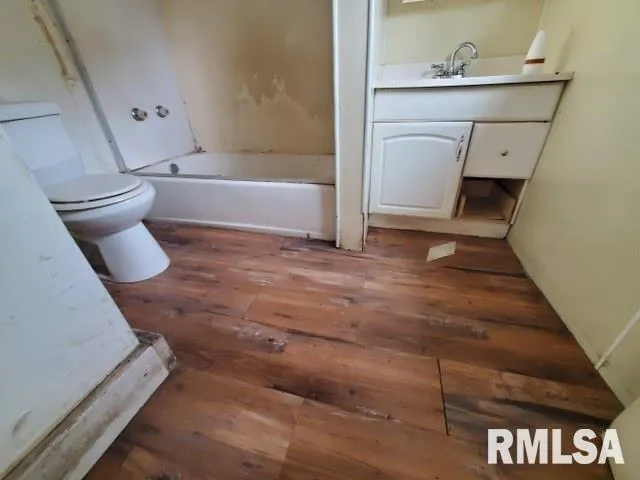 a bathroom with a bathtub and a toilet