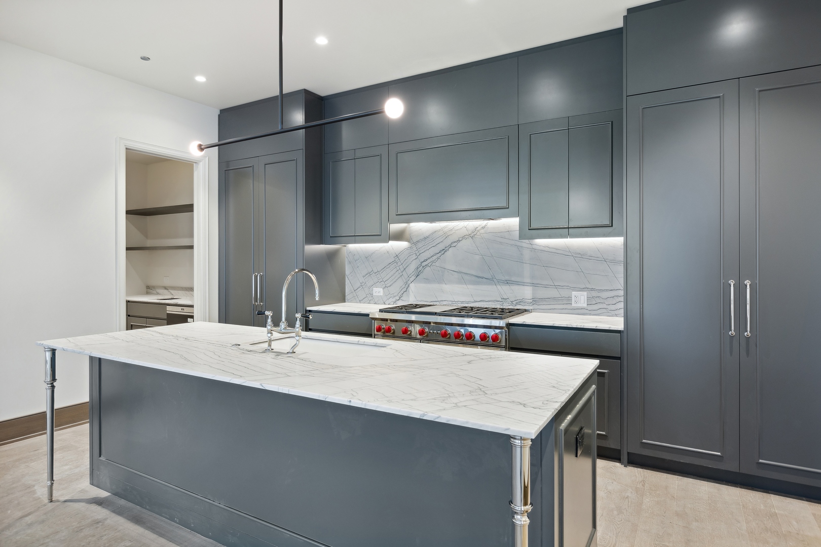 21 North May Street, Unit 602 Chicago, IL 60607 - Photo 16 of 39 a kitchen with a stove a refrigerator and a sink