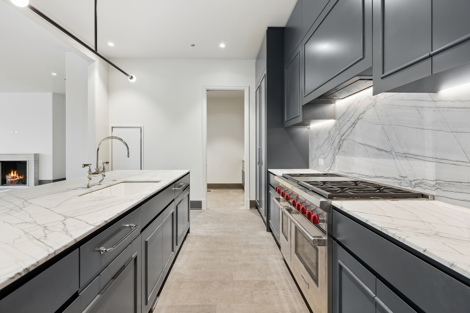 21 North May Street, Unit 602 Chicago, IL 60607 - Photo 18 of 39 a kitchen with a sink stove and cabinets