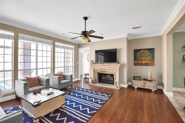 a living room with furniture a rug and a fireplace
