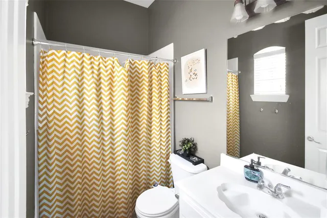 a bathroom with a sink and toilet