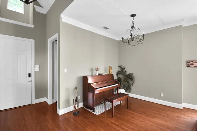 a room with furniture and wooden floor