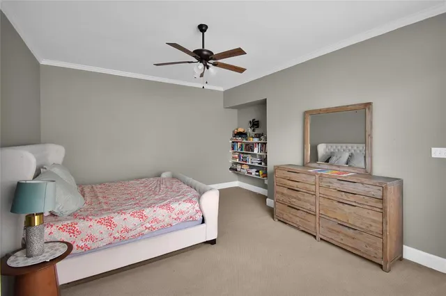 a bedroom with a bed and lamp