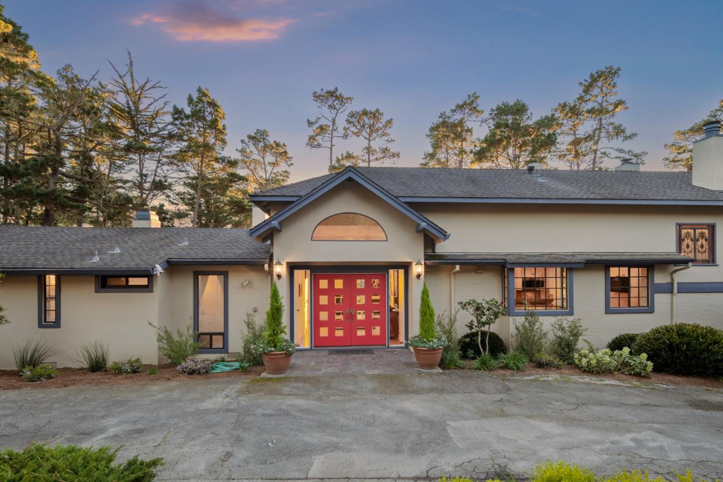 1424 Oleada Road Pebble Beach, CA 93953 - Photo 2 of 30 a front view of a house with garden