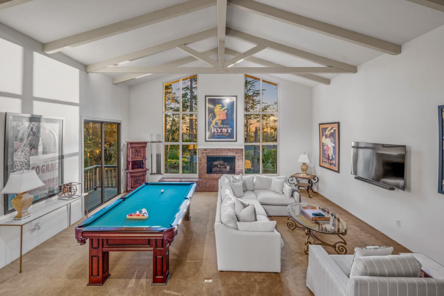 1424 Oleada Road Pebble Beach, CA 93953 - Photo 4 of 30 a room with furniture a flat screen tv and a fireplace