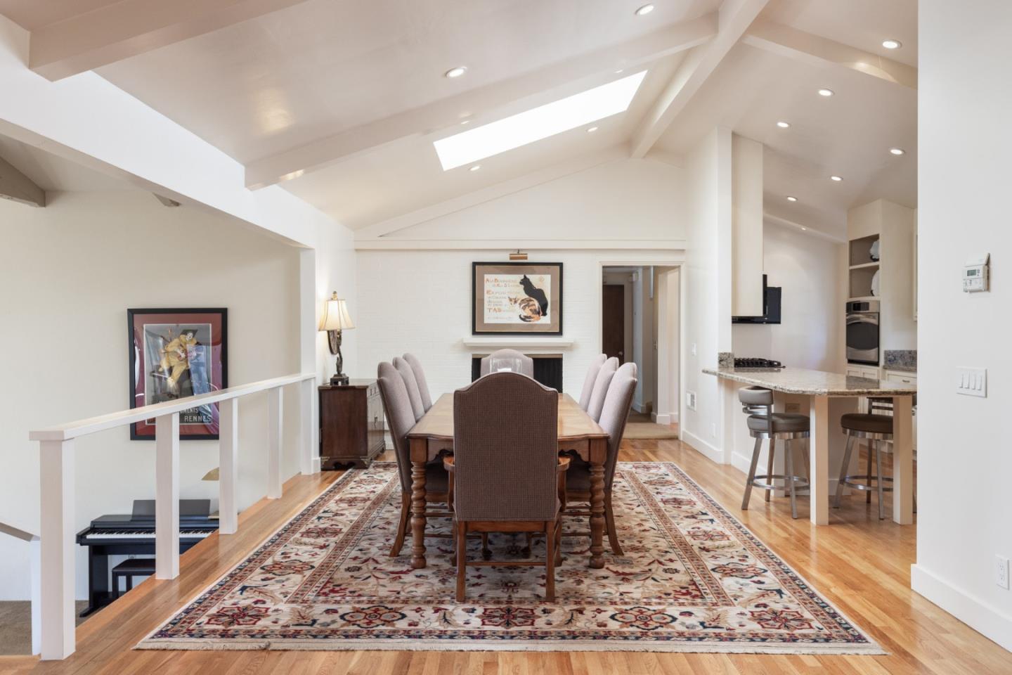 1424 Oleada Road Pebble Beach, CA 93953 - Photo 7 of 30 a dining room with wooden floor and a rug