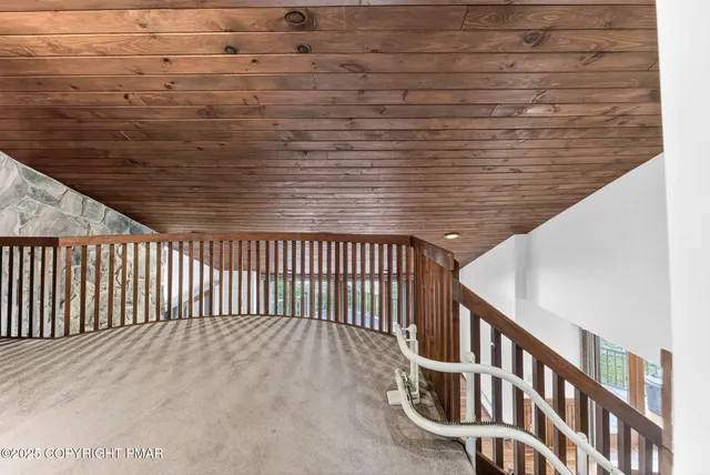 a view of balcony with wooden floor and fence