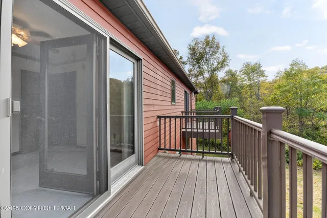 a view of a room with a chandelier fan and closet