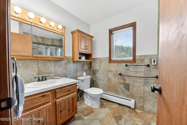 a bathroom with a glass shower door