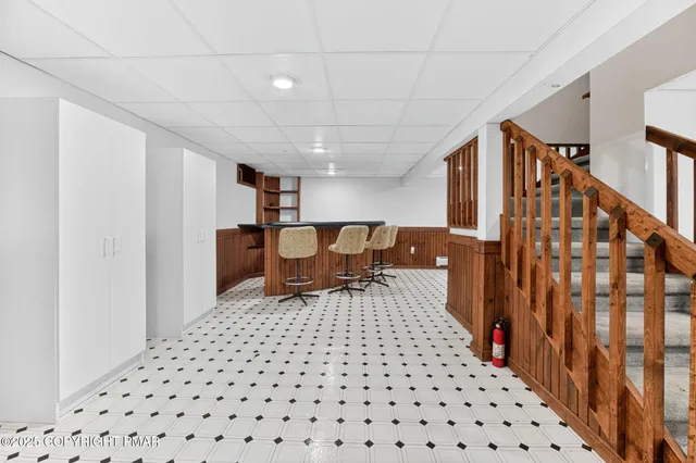 a patio with wooden floor and outer view