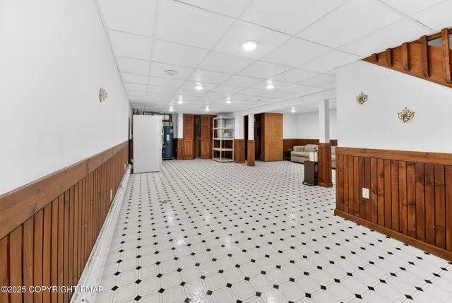 a patio with wooden floor a yard tables and chairs