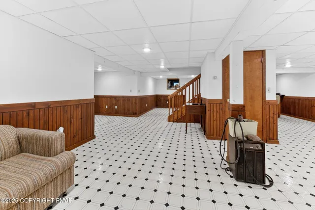 a view of a house with a tree and yard