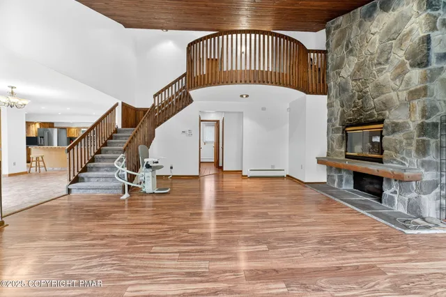 a view of an entryway with wooden floor