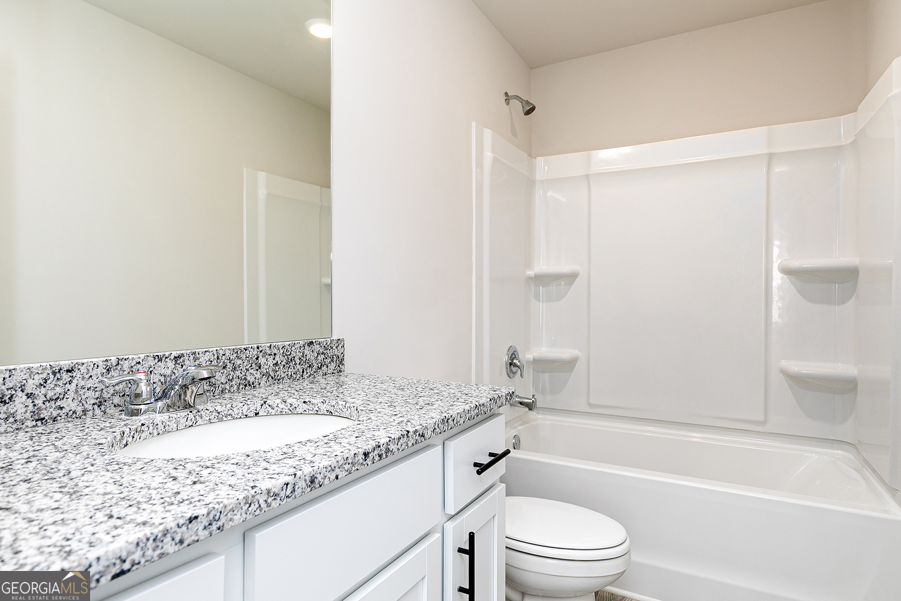 622 Mackenzie Cove Villa Rica, GA 30180 - Photo 14 of 14 a bathroom with a granite countertop sink toilet and shower