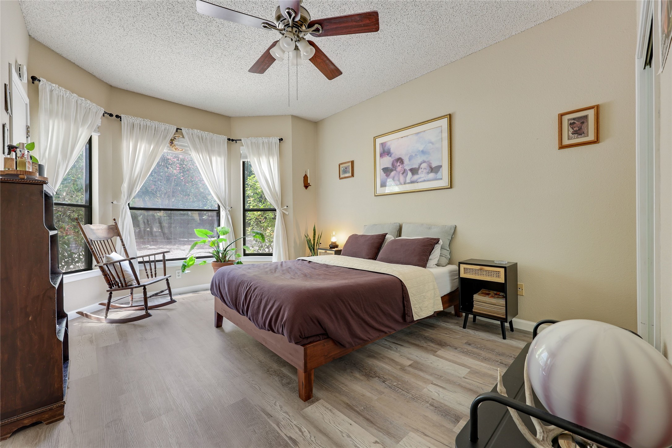 3011 Fruth Street, Unit 101 Austin, TX 78705 - Photo 9 of 14 A peaceful bedroom retreat with ample natural illumination and resilient laminate flooring.